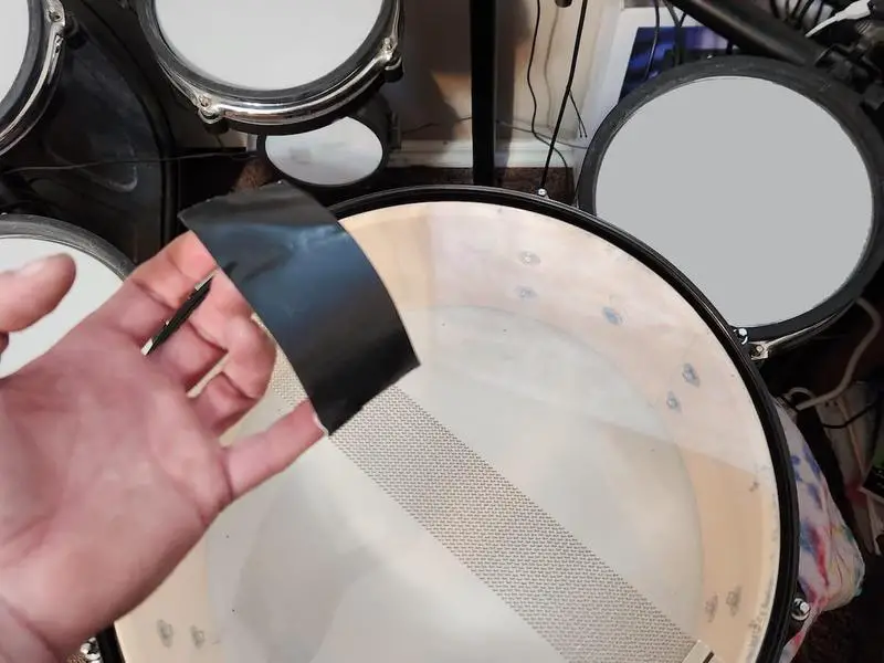 Black tape cut to use as a drum dampener
