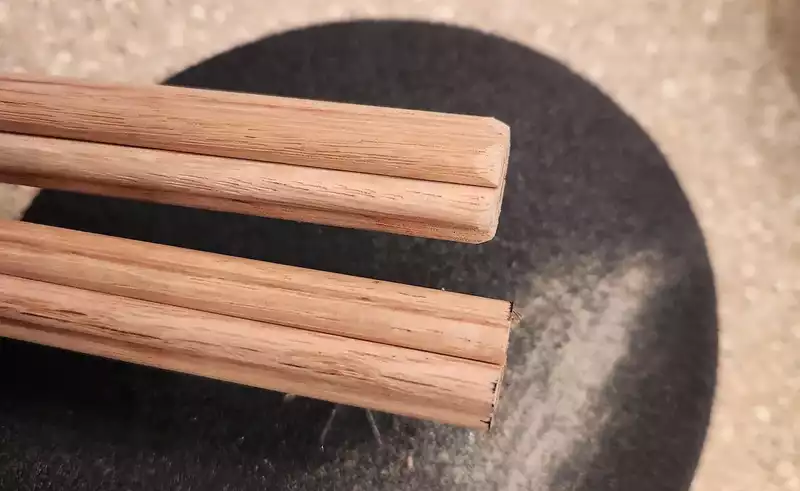 Tapering the edges of the rods using sandpaper